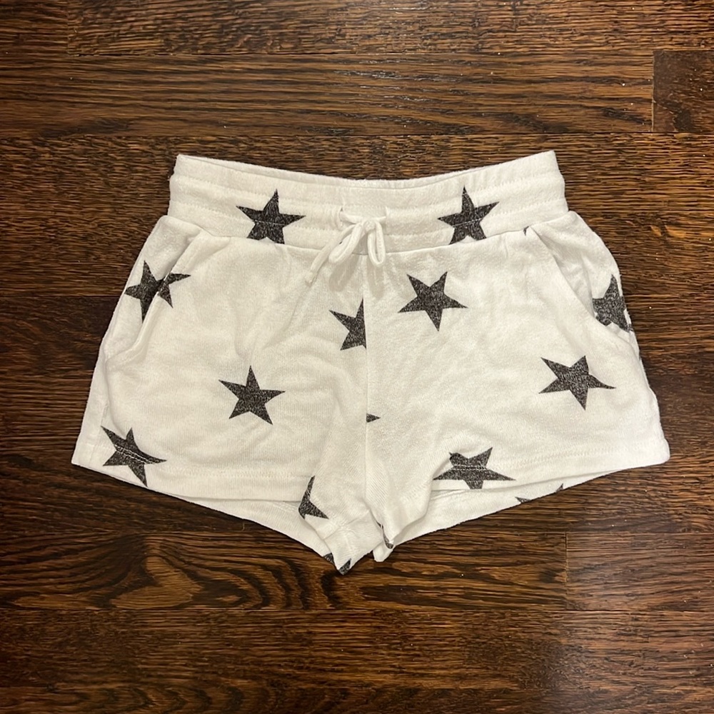 White shorts with blackish stars, pockets, & drawstring